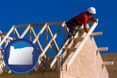 oregon map icon and a carpenter building a house, working on roof joists